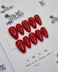 A sheet of red oval-shaped PRESSON      displayed on a white backing card, photographed from above on a white background with repeated Palm & Polish branding.